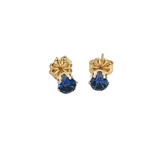 A pair of blue sapphire stud earrings with 14k gold-filled baskets and gold-filled push-backs on a white background, front overview. 
