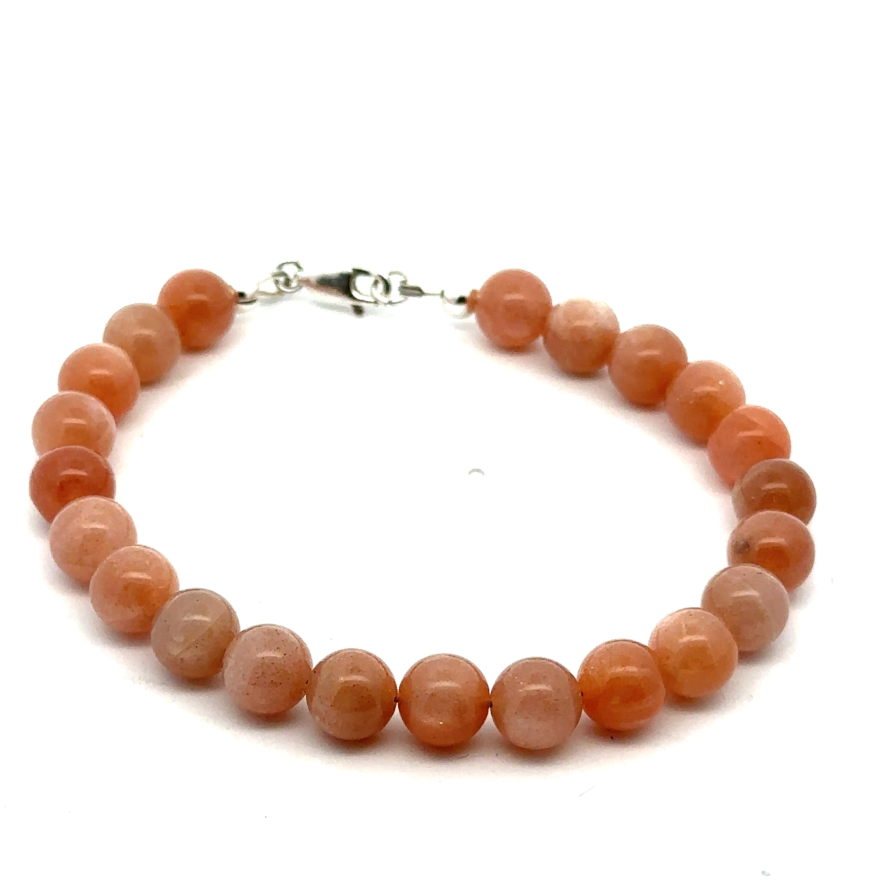 A peach Moonstone gemstone beaded bracelet with a sterling silver lobster claw clasp on a white background, front, overview. 