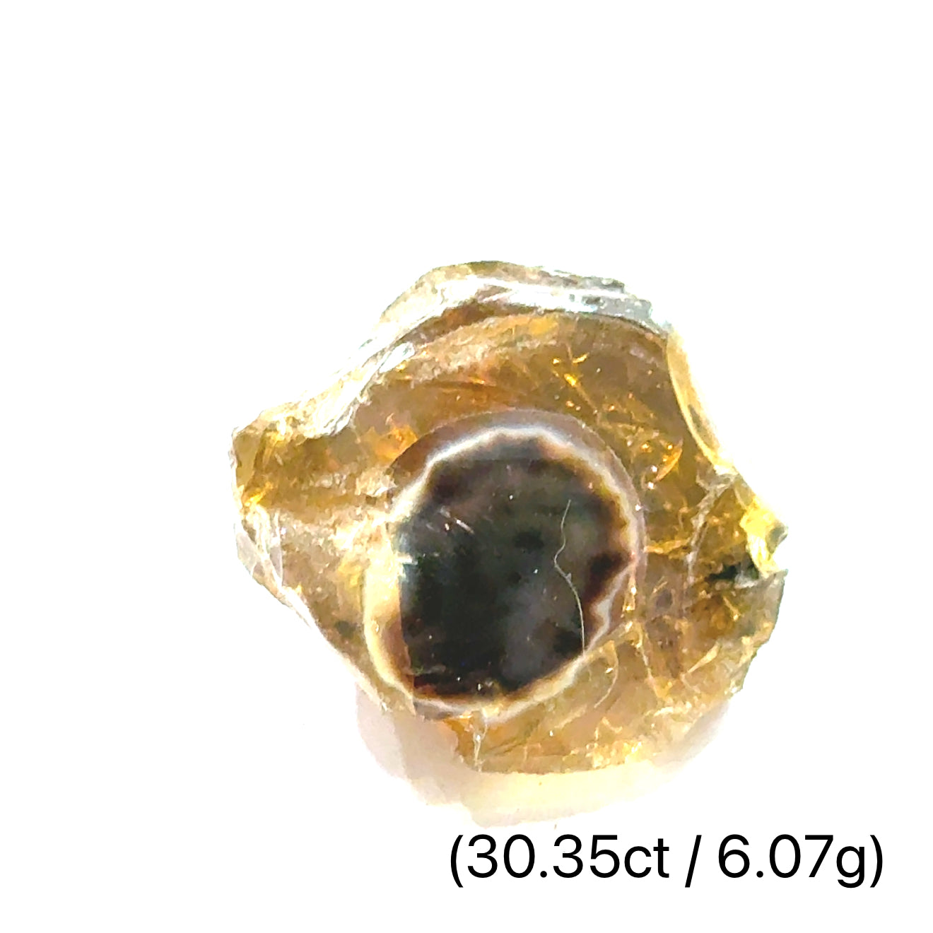 A raw brown Ethiopian opal gemstones with varying colors, displayed on a white background, 6.07g.