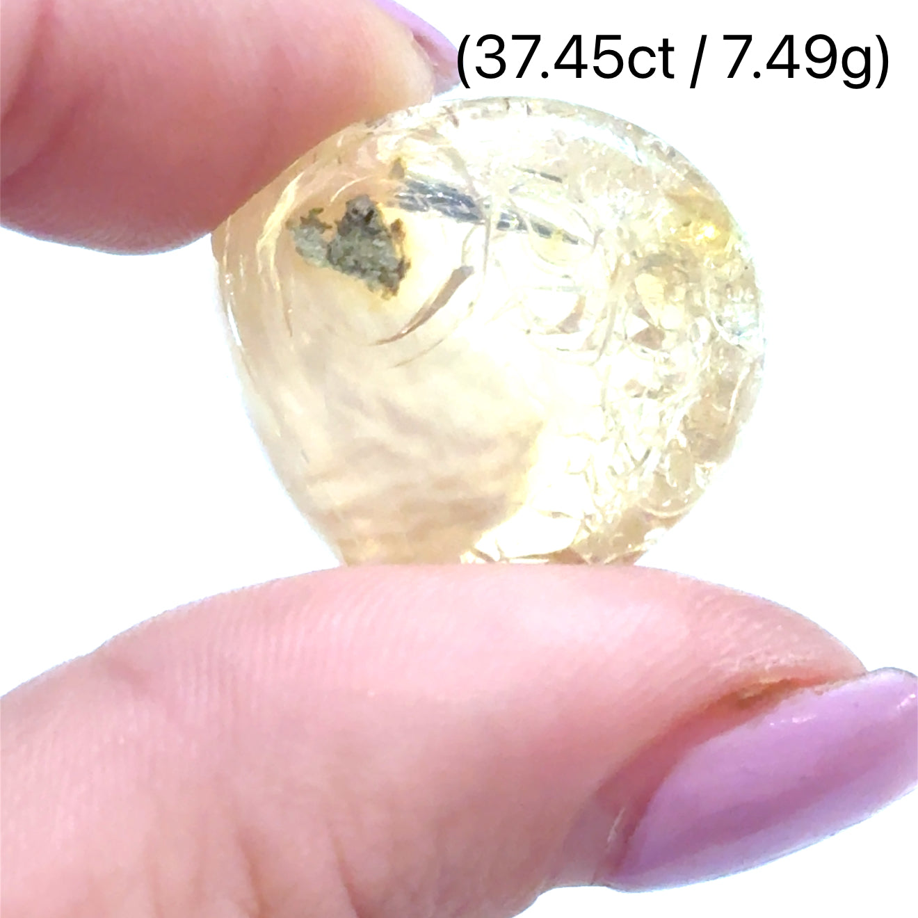 A raw white Ethiopian opal gemstones with varying colors, displayed on a white background, 7.49g.