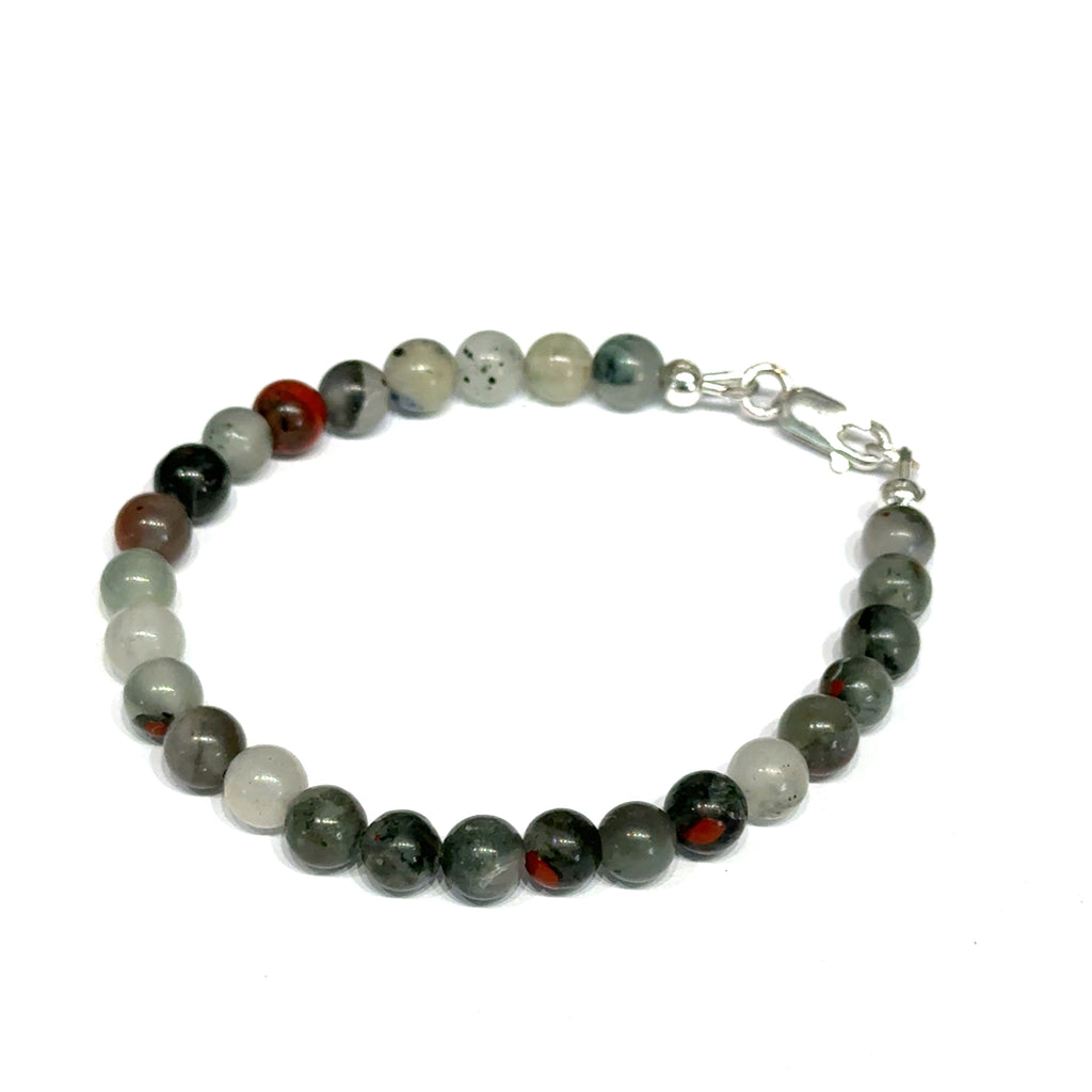 African bloodstone beaded bracelet with 6mm smooth round gemstones and sterling silver lobster claw clasp for courage and vitality on a white background, front left angle view. 