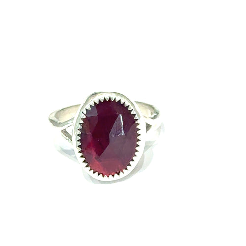 Almandine Garnet gemstone sterling silver ring on a white background, front view.  