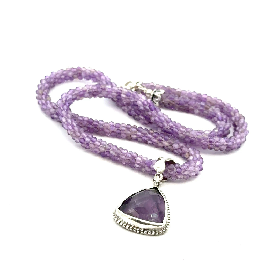 Reiki jewelry in Boston handmade with ethically sourced amethyst gemstones  with Pendant on white over view center view