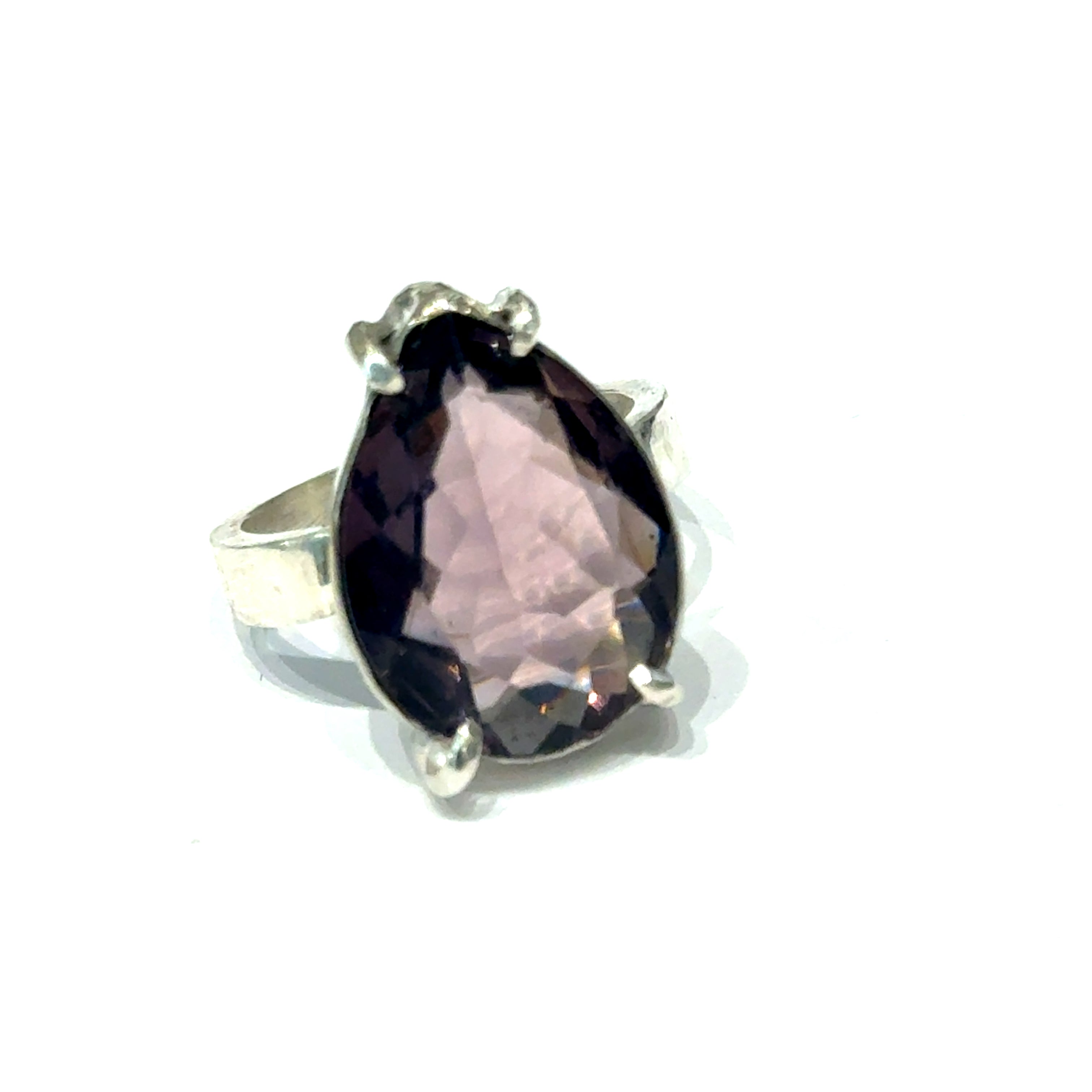 An Ametrine Ring with a purple teardrop-shaped gemstone on a  white background, front close up view.