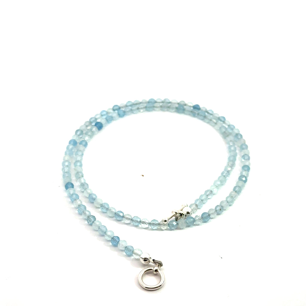 Aquamarine Gemstone Beaded necklace on white front spiral view