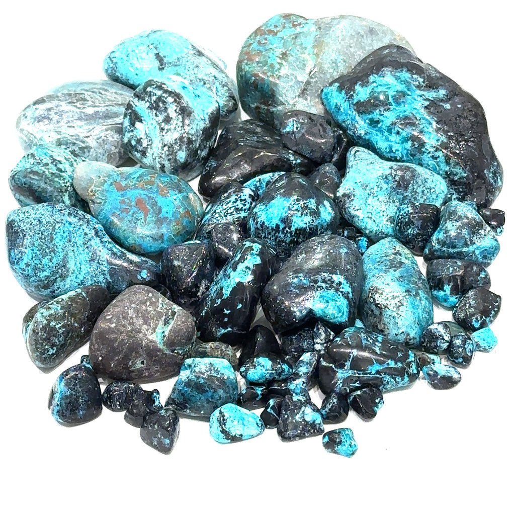 Assorted Azurite / Chrysocolla gemstones with varied shades of turquoise and deep blue, symbolizing harmony and intuition on white overview