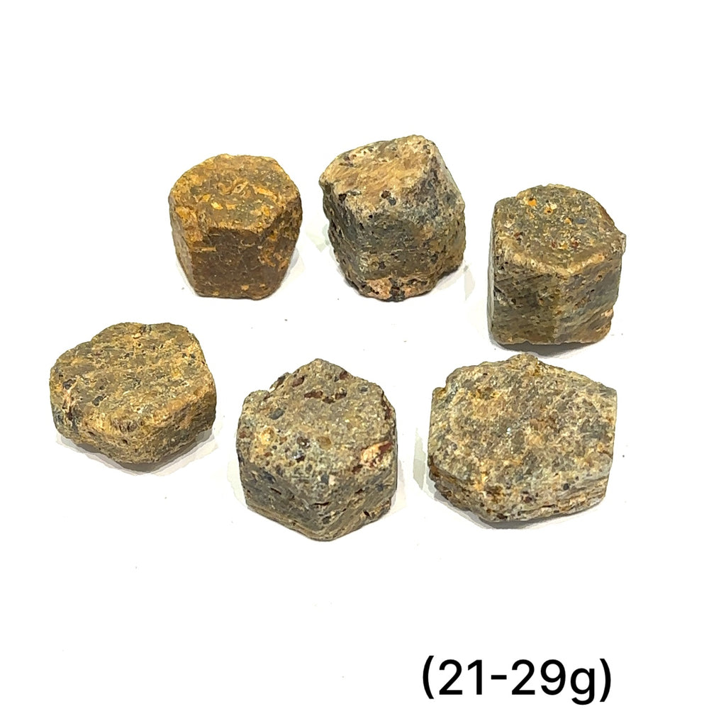  Assorted Golden Sapphire stones with metallic shimmer representing good fortune and transformation grouping of (21-29g) on white overview