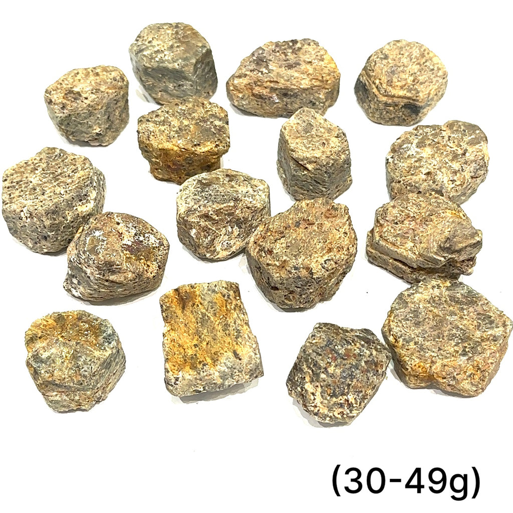  Assorted Golden Sapphire stones with metallic shimmer representing good fortune and transformation grouping of (30-49g) on white overview