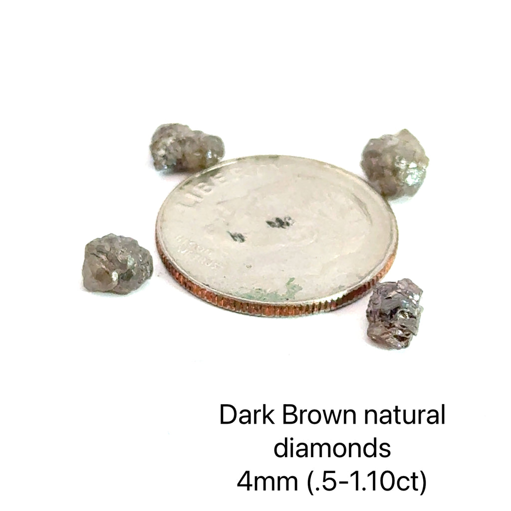 Assorted raw diamonds in perky boxes, representing purity and light. (Dark Brown  natural diamond 4mm .5- 1.10ct) on white front view