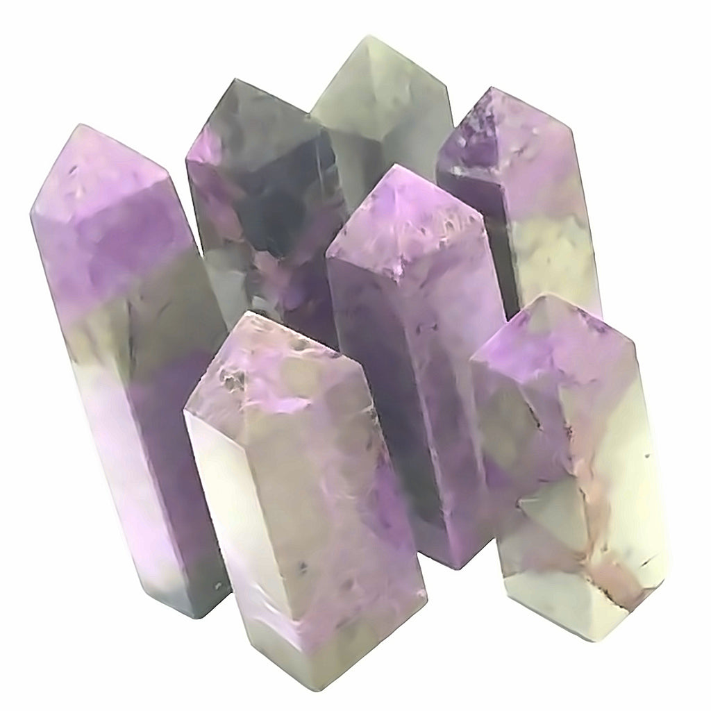 Atlantisite Gemstone Tower grouping  on white up close overview