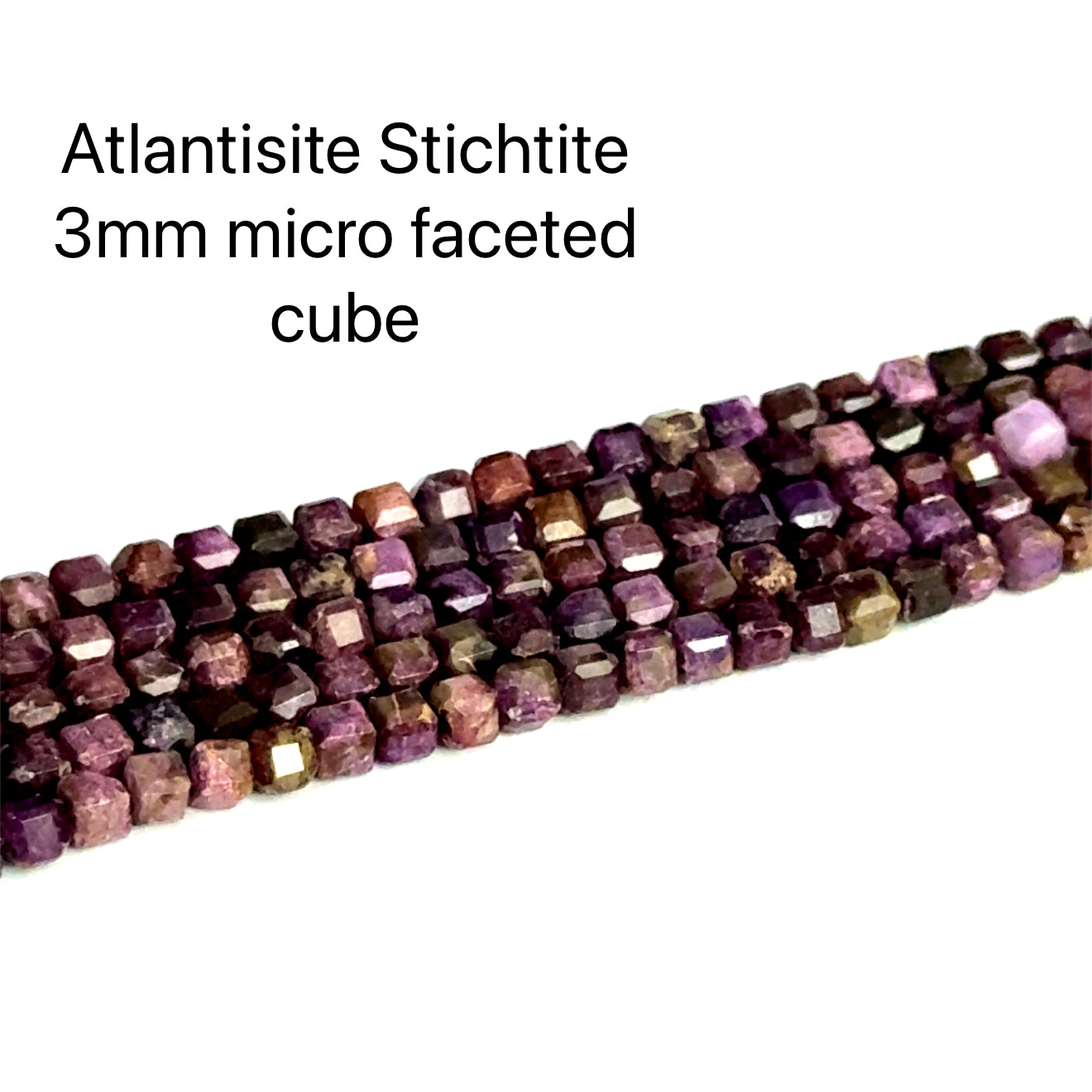 Atlantisite Stichtite 3mm micro-faceted cube gemstone strand on a white background, overview. 