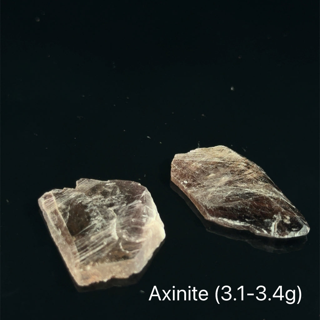 Axinite Raw Gemstones 3.1-3.4g on black 