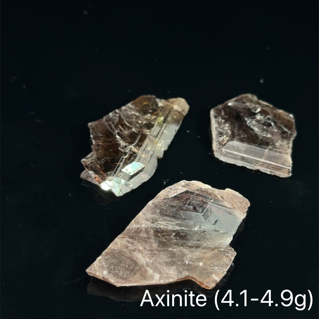 Axinite Raw Gemstones 4.1-4.9g on black 