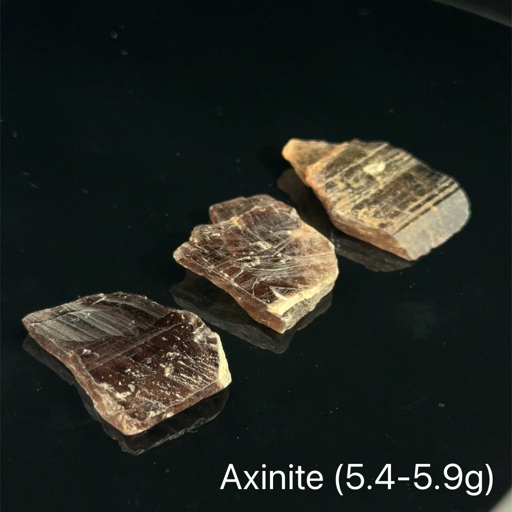 Axinite Raw Gemstones  5.4-5.9g on black 
