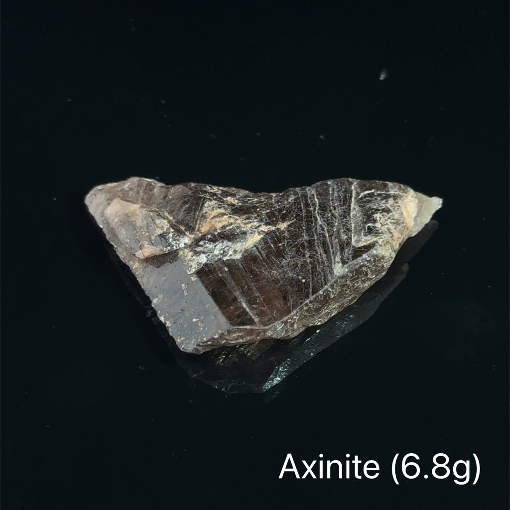 Axinite Raw Gemstones  6.8g on black 