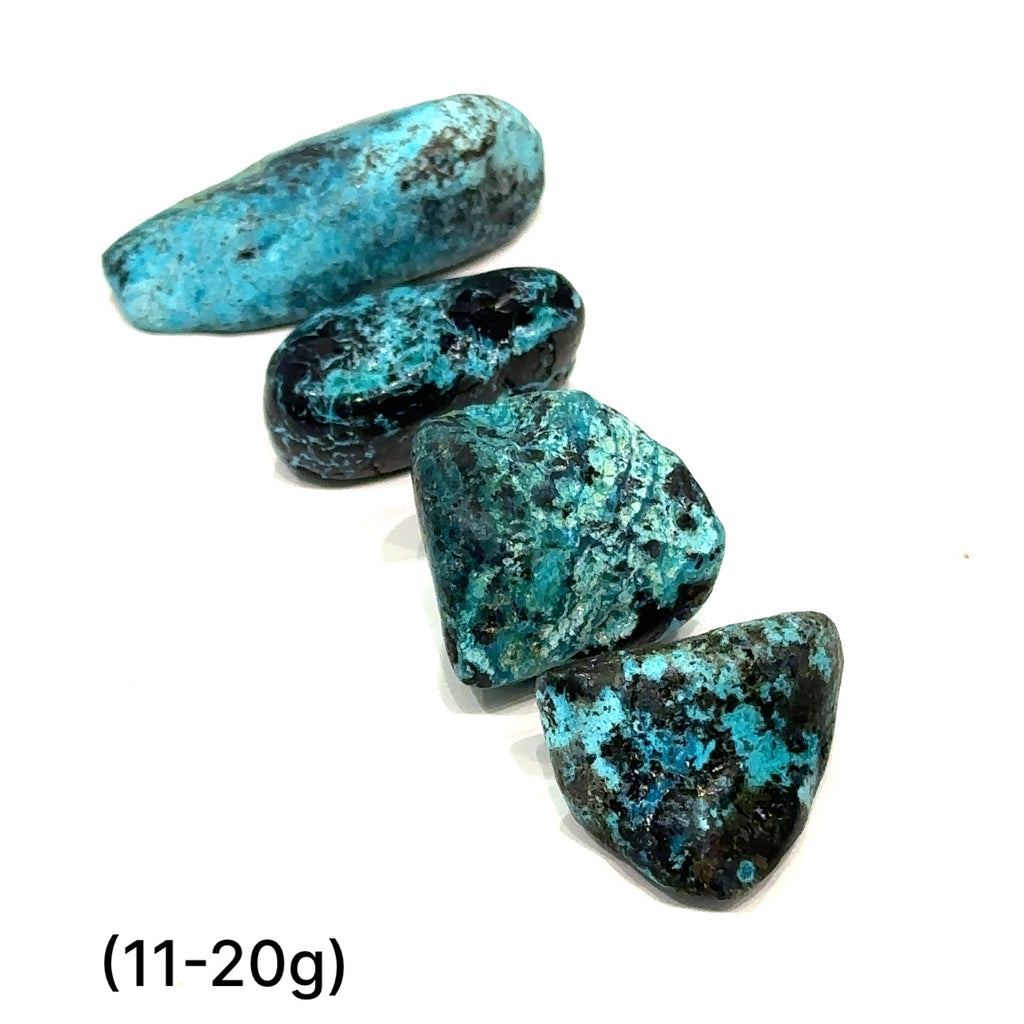 Azurite and Chrysocolla gemstone with deep blue and green patterns symbolizing intuition and empowerment of (11-20g) on white overview