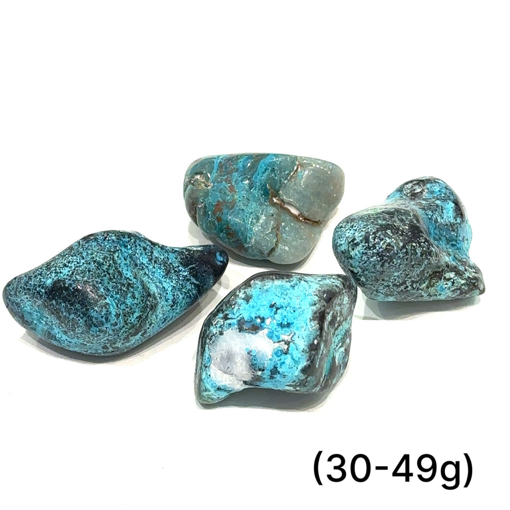 Azurite and Chrysocolla gemstone with deep blue and green patterns symbolizing intuition and empowerment of (30-49g) on white overview