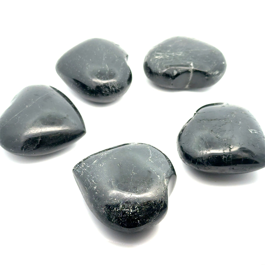 Black Tourmaline gemstone hearts on white grouping over view