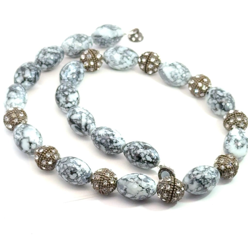 Black & White Marbled Beaded Necklace on white spiral center overview