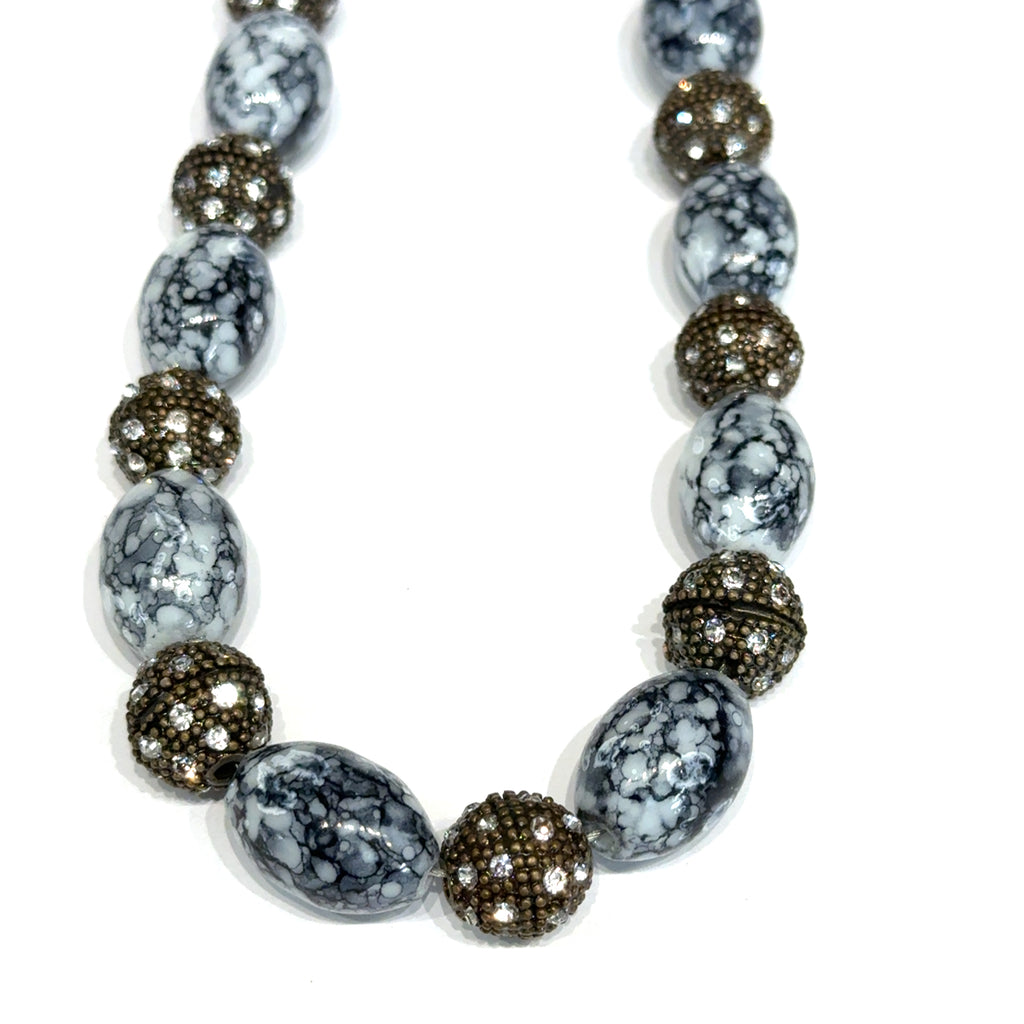 Black & White Marbled Beaded Necklace on white spiral hanging overview