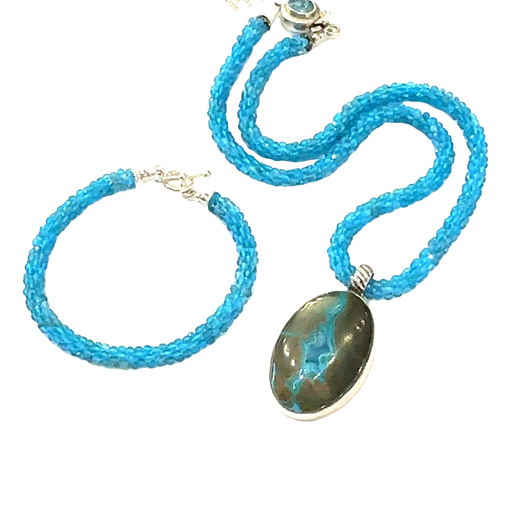 Blue Apatite crocheted gemstone necklace with Gem Silica Druzy pendant with its matching bracelet handmade by Hidden Jewel. on a white background center overview 