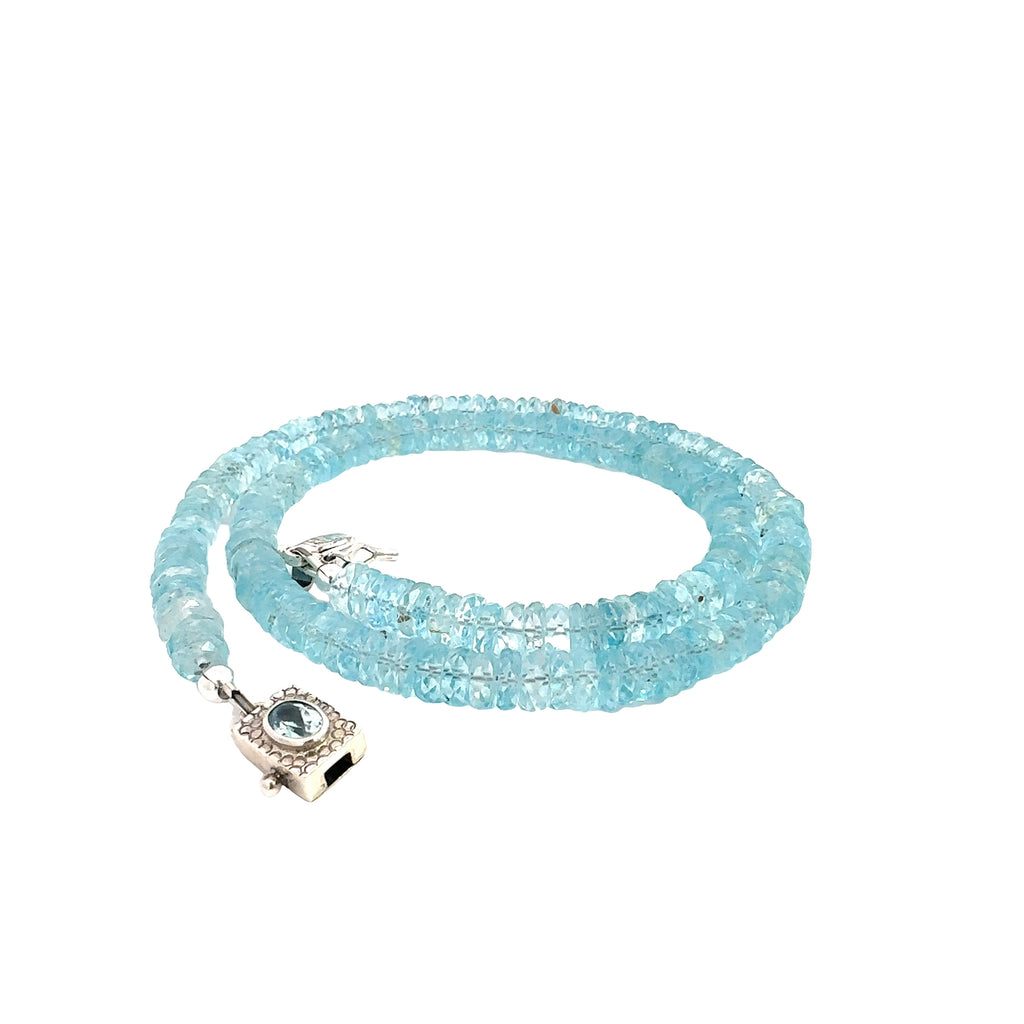 Blue Topaz Gemstone Necklace  on white front side close up spiral  view
