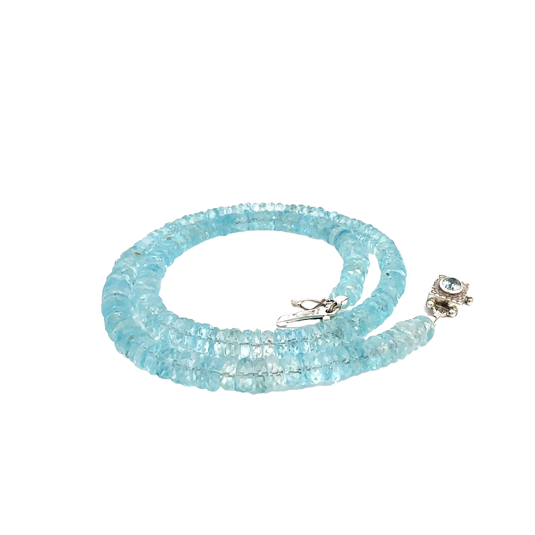 Blue Topaz Gemstone Necklace  on white left side close up spiral  view