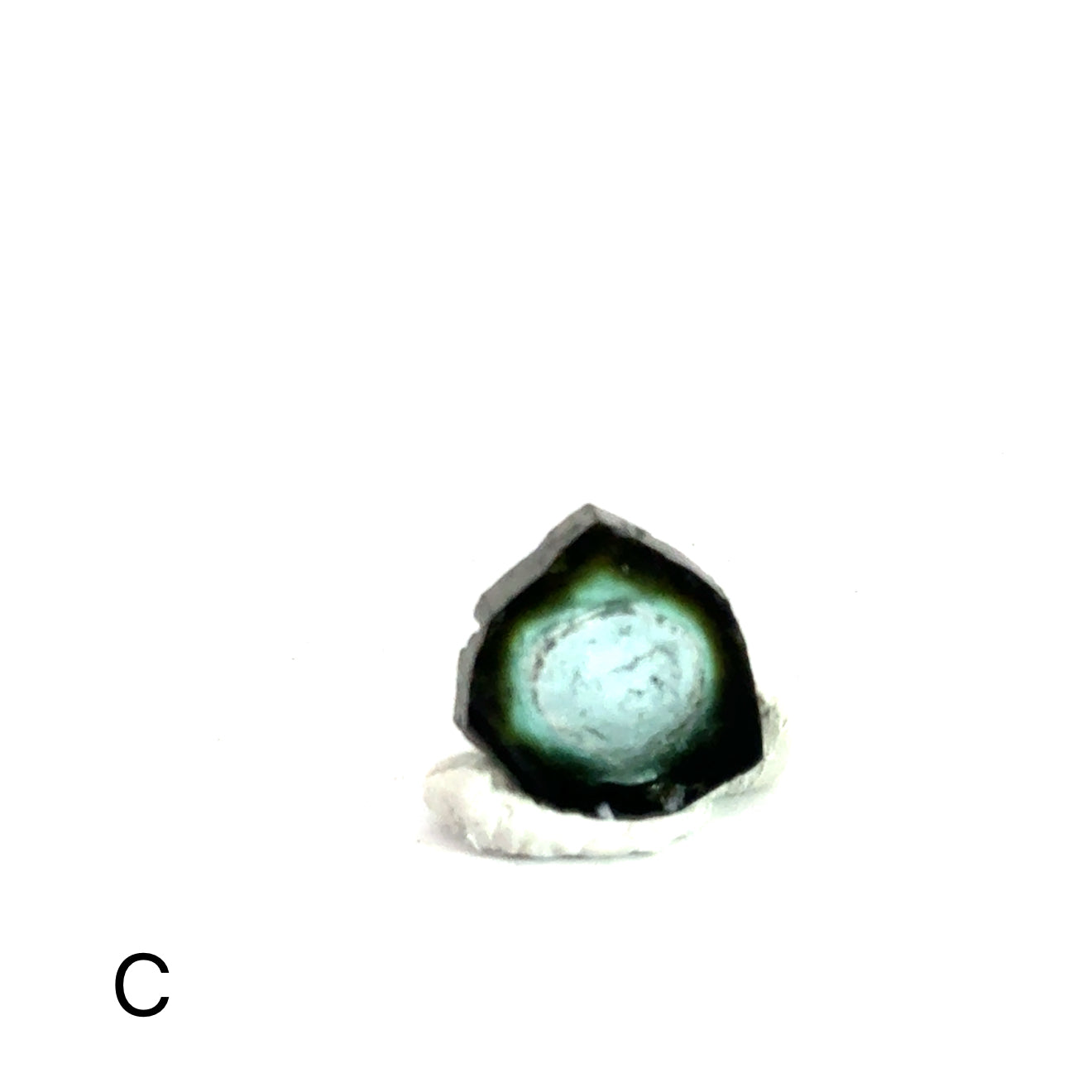 Blue Tourmaline Raw Gemstone Slice on white  C on front view