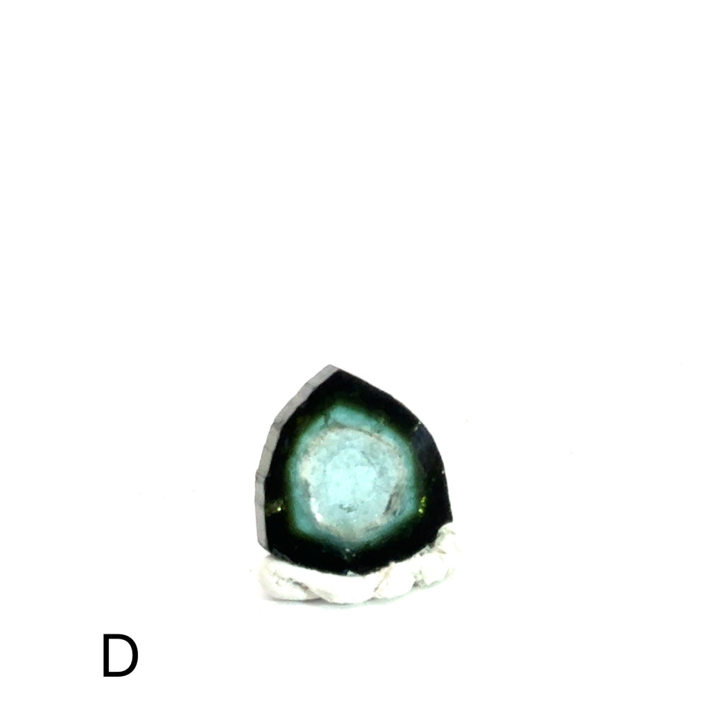 Blue Tourmaline Raw Gemstone Slice on white  D on front view