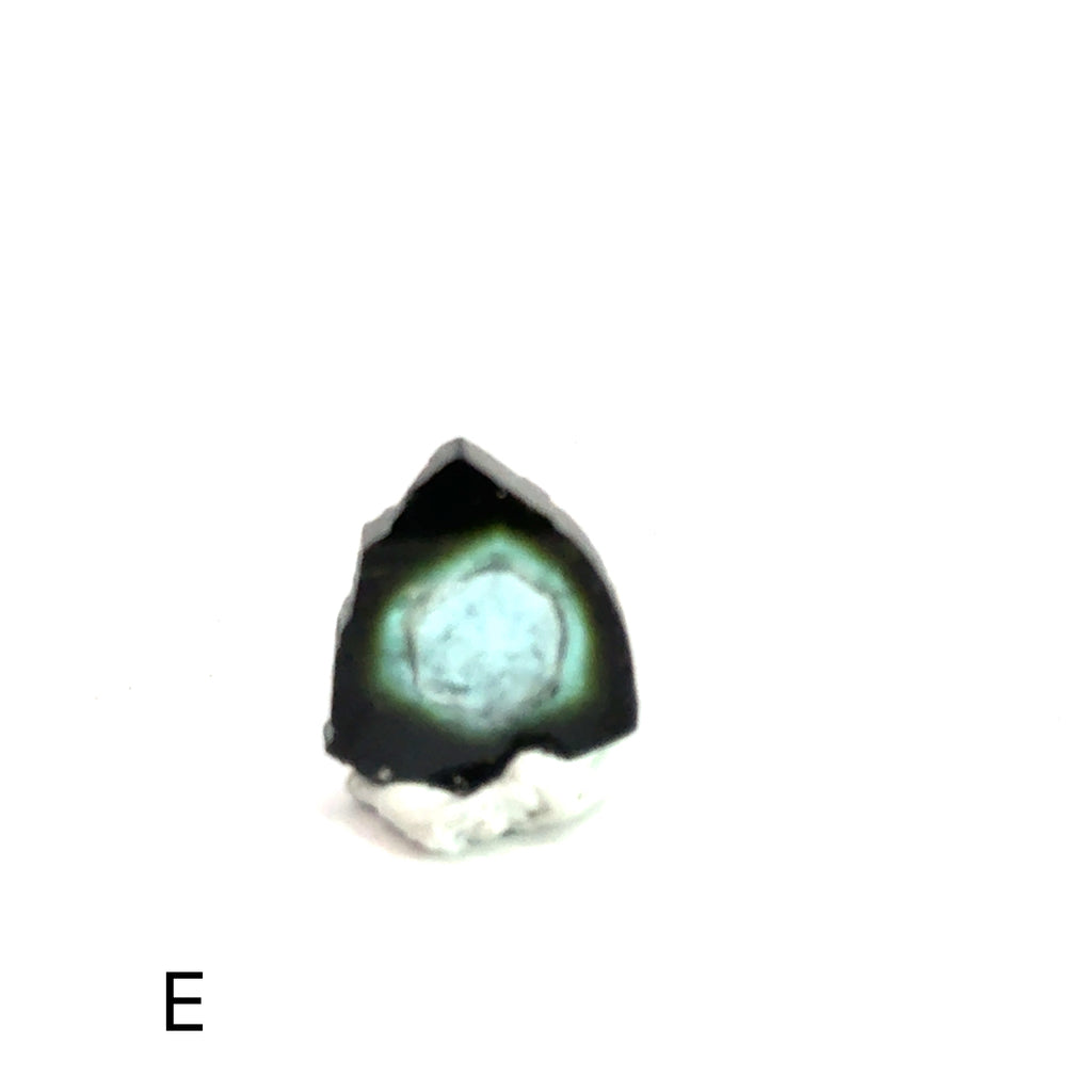 Blue Tourmaline Raw Gemstone Slice on white  E  on front view
