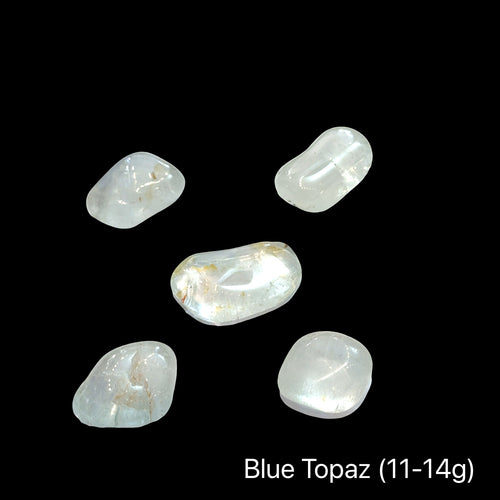 Blue topaz stones, 11-14g each, on a black background, front view.