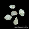 Blue topaz stones, 15-18g each, on a black background, front view.