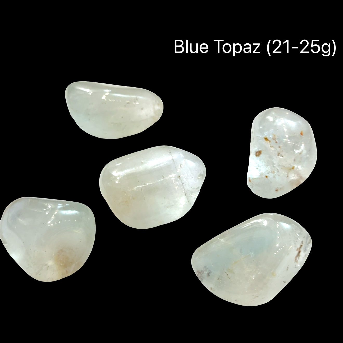 Blue topaz stones, 21-25g each, on a black background, front view.