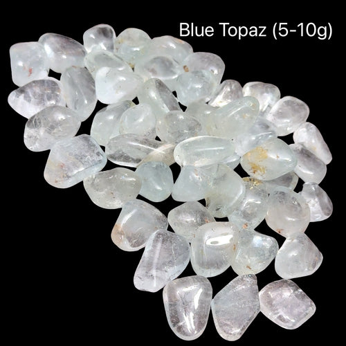 Blue topaz stones, 5-10g each, on a black background, front view.
