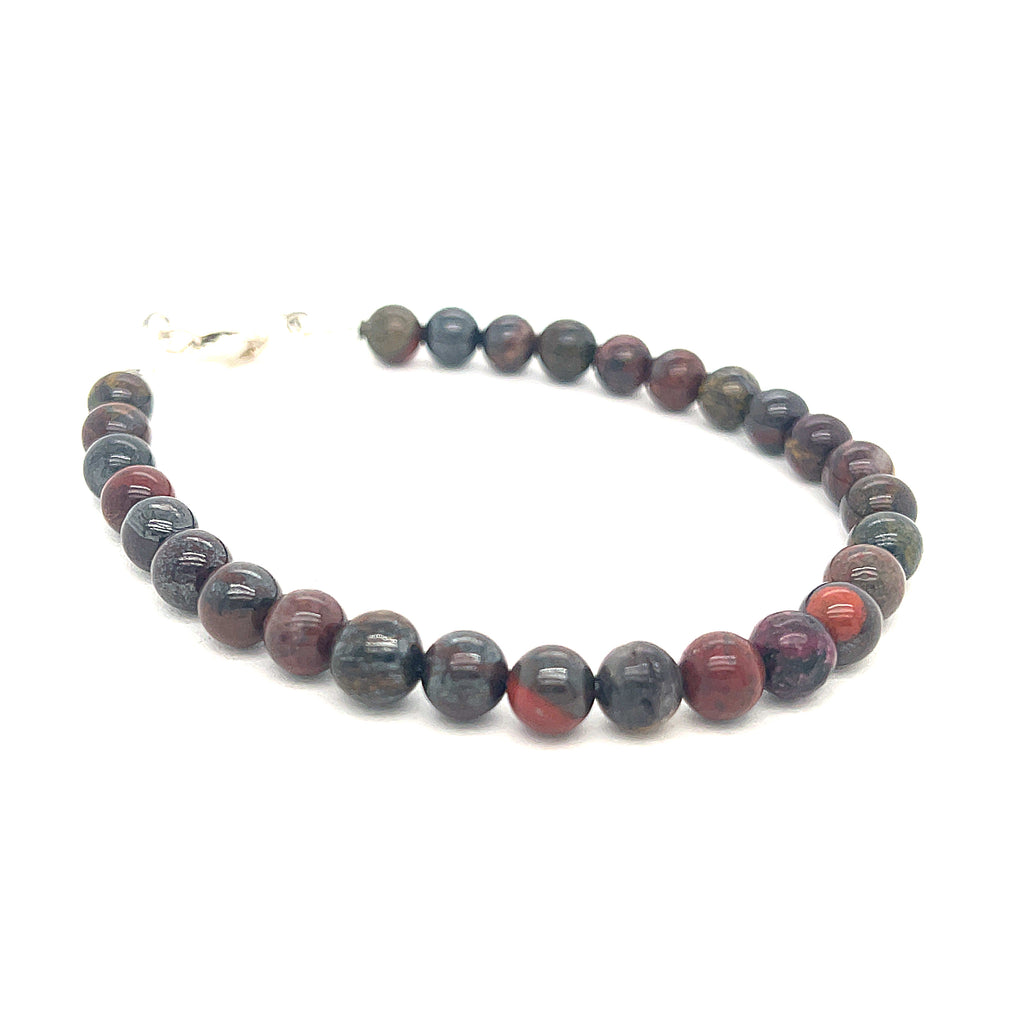 Brecciated Jasper gemstone bracelet with 6mm beads and sterling silver lobster clasp, 7.25 inches long on white front angle overview