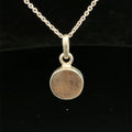 Brown Confetti Moonstone Sunstone pendant set in sterling silver bezel on a black background, hung, front view. 