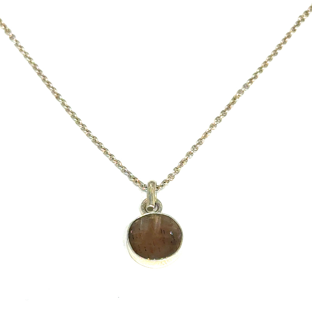 Brown Confetti Moonstone Sunstone pendant set in sterling silver bezel on a white background, hung  front, close up overview.