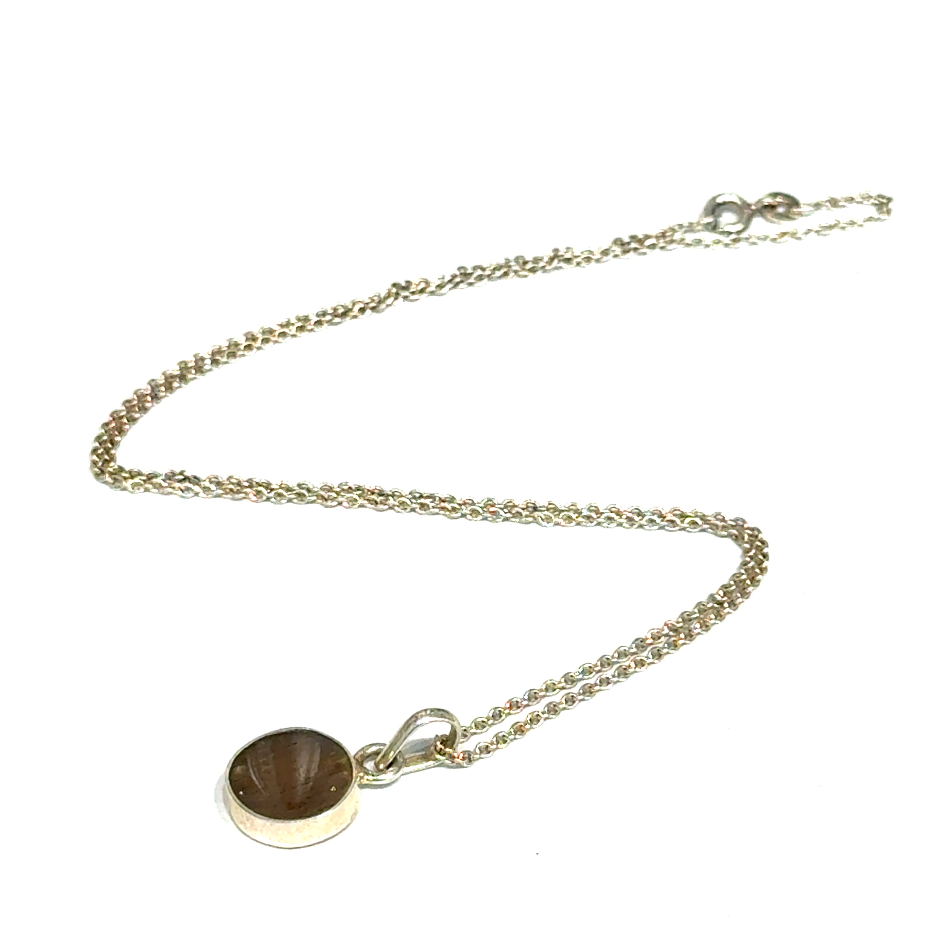 Brown Confetti Moonstone Sunstone pendant set in sterling silver bezel on a white background, left angle front, overview. 
