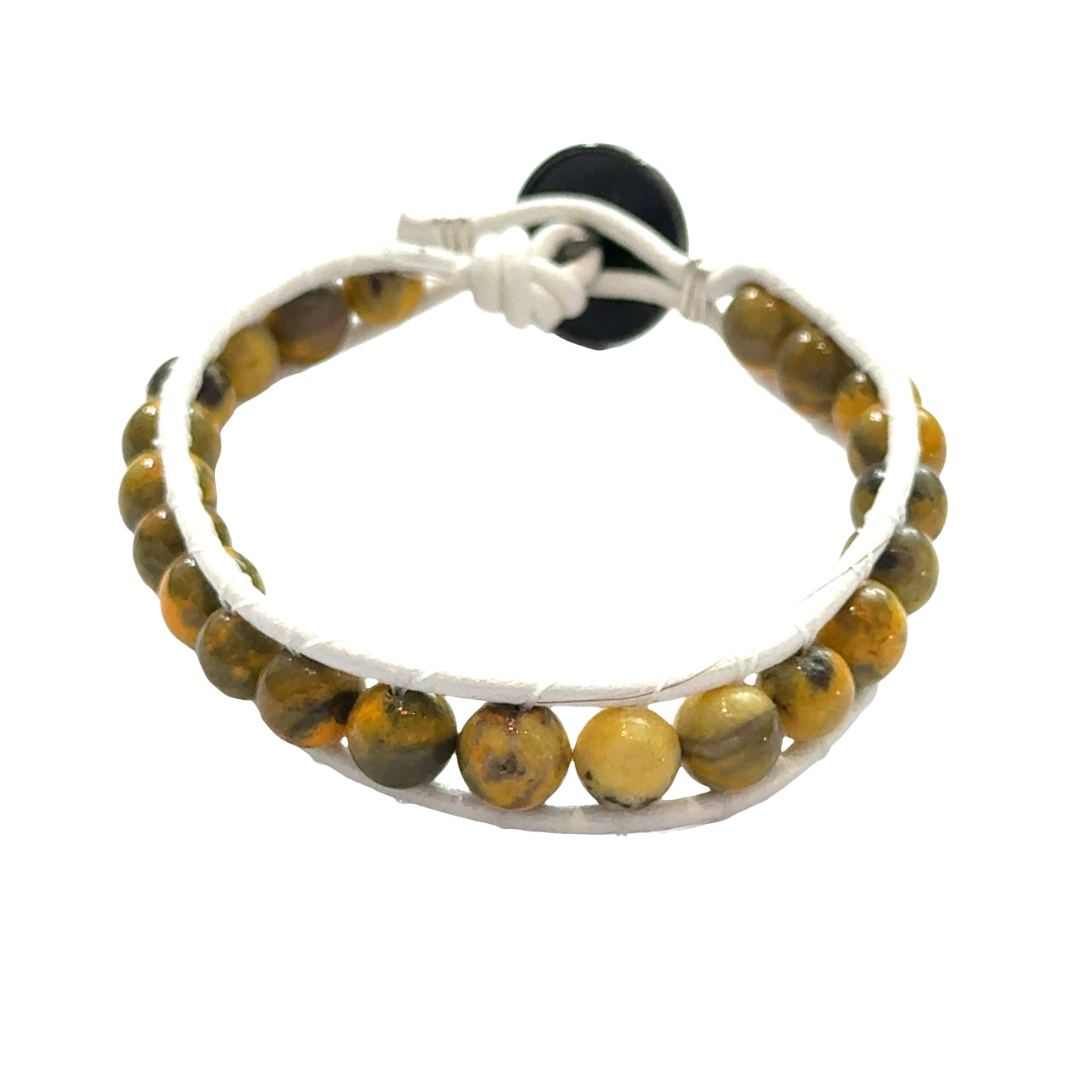 Bumblebee Jasper leather wrap bracelet with 6mm yellow and black beads on white leather, brass flower button, unisex spiritual jewelry, on white background, front view.