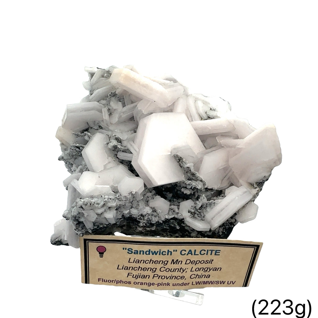 Calcite “Sandwich” Raw Gemstone on white front and center view with information card