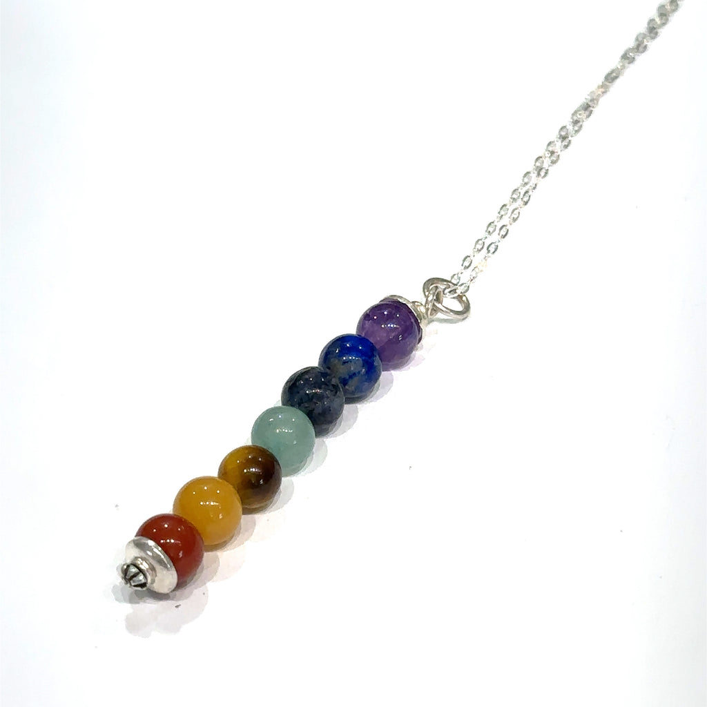 Chakra balancing necklace with amethyst, lapis lazuli, sodalite, aventurine, jade, tiger eye, red jasper on white center long overview