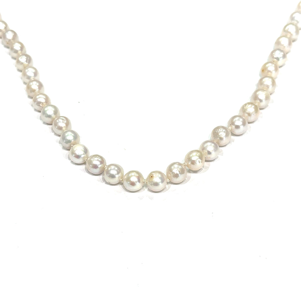 Classic freshwater pearl strand for weddings, anniversaries, and everyday wear on white front hanging overview