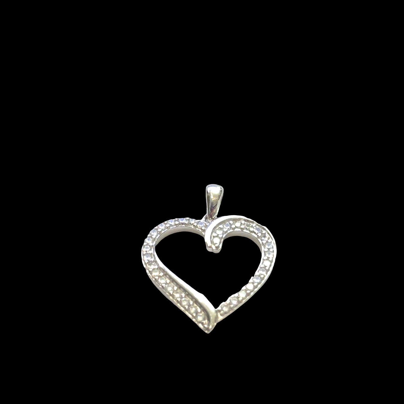 Classic sterling silver heart pendant with pavé cubic zirconia stones, 925 stamp, romantic love jewelry, 1 inch elongated heart, on a black background, front view. 