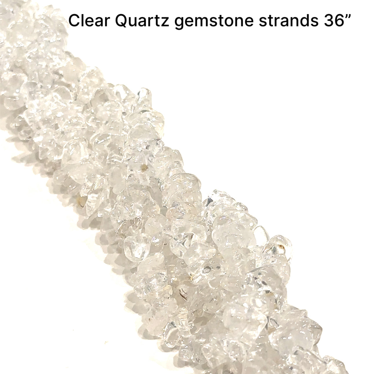 Clear Quartz gemstone chips strand 36'' on a white background, overview. 
