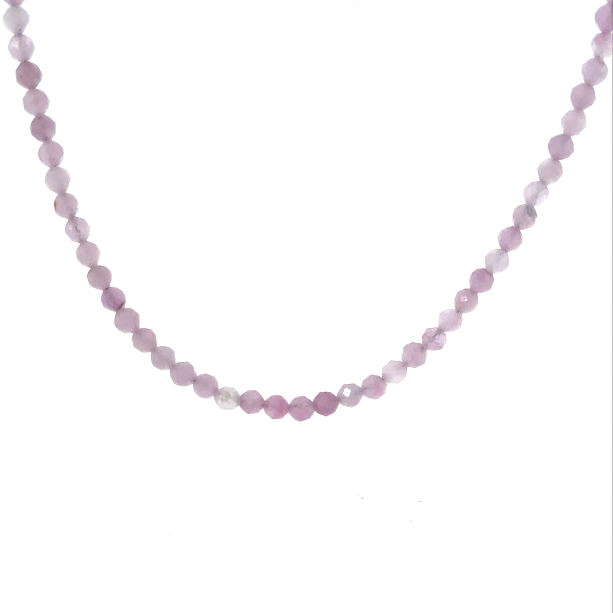 Close-up of 3mm micro-faceted round kunzite beads on Beadalon wire with sterling silver findings showing natural pink to lavender color shift, ethically sourced gemstone jewelry Boston