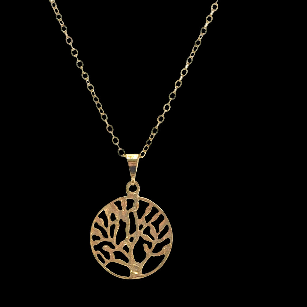 Close-up of Tree of Life pendant showing detailed branch work and circular design, on a Black background hanging from a 18'' gold filled chain, front view. 