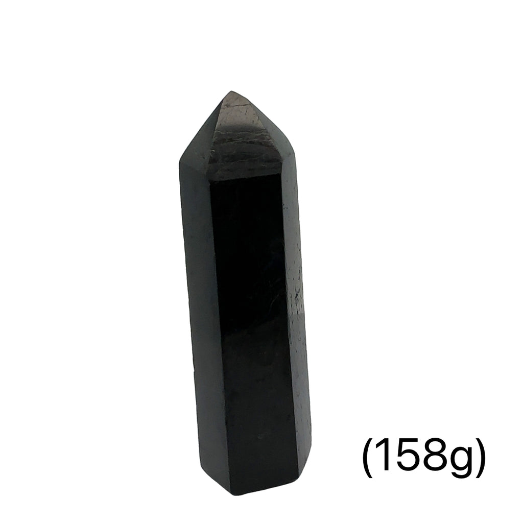 Close-up of a collection of Black Tourmaline crystal showing natural striations and deep black luster on a white background front view (158g)