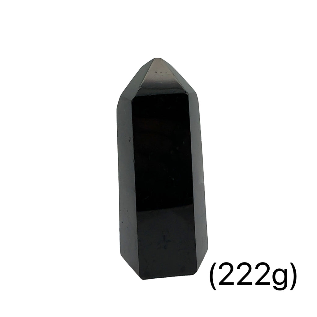 Close-up of a collection of Black Tourmaline crystal showing natural striations and deep black luster on a white background front view (222g)