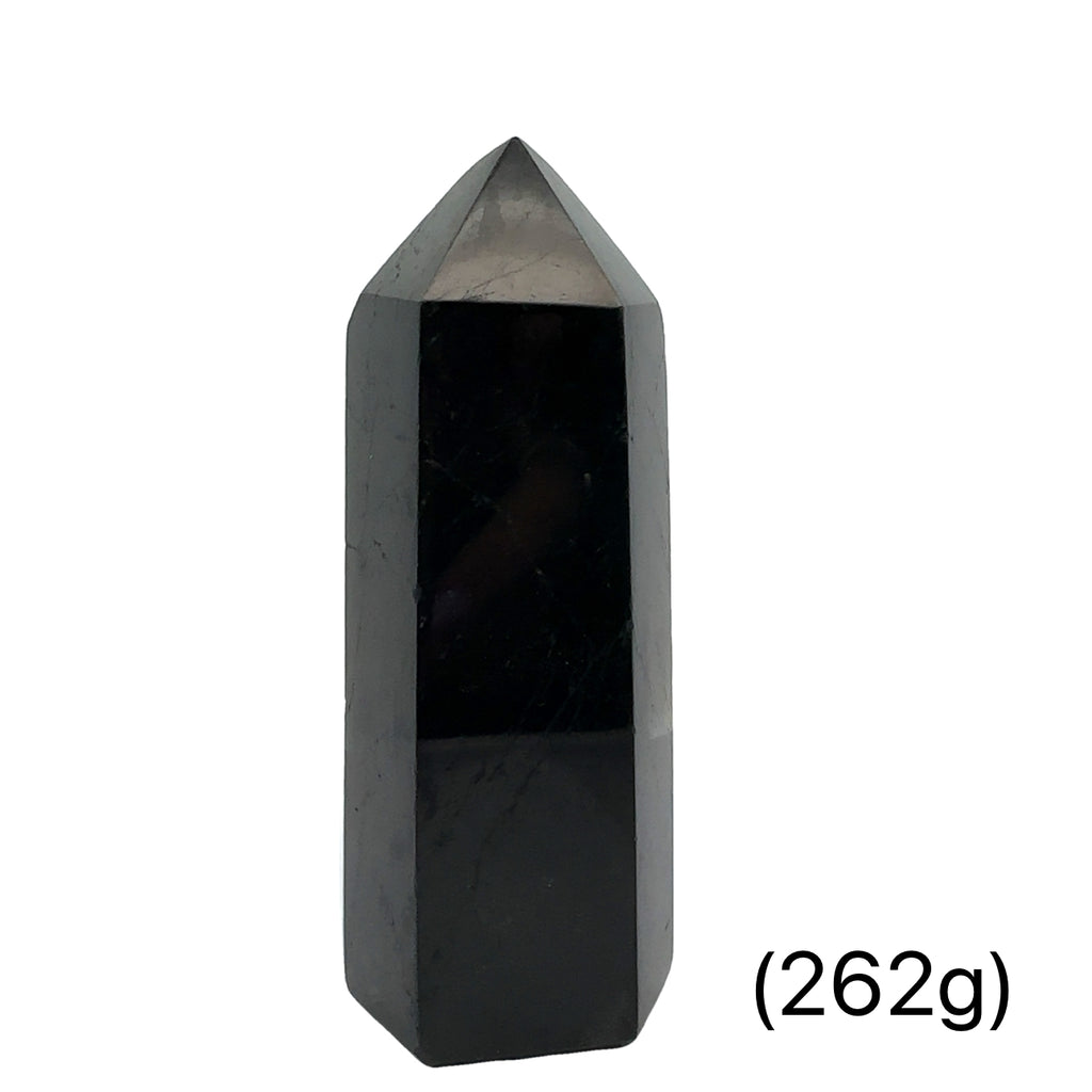 Close-up of a collection of Black Tourmaline crystal showing natural striations and deep black luster on a white background front view (262g)