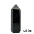 Close-up of a collection of Black Tourmaline crystal showing natural striations and deep black luster on a white background front view (262g)